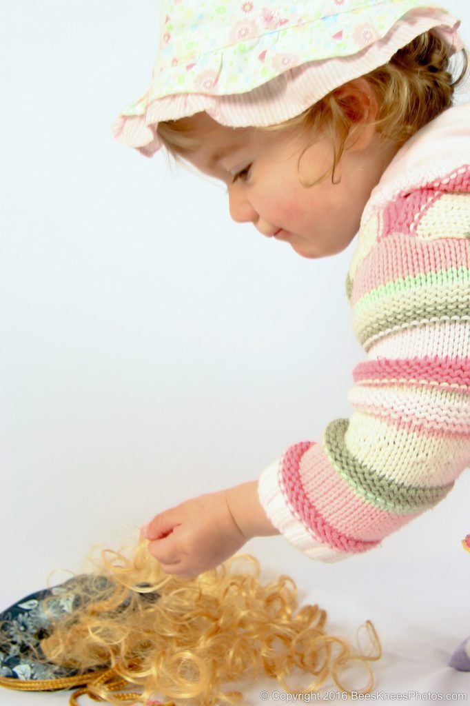 a girl playing in the studio at a photoshoot