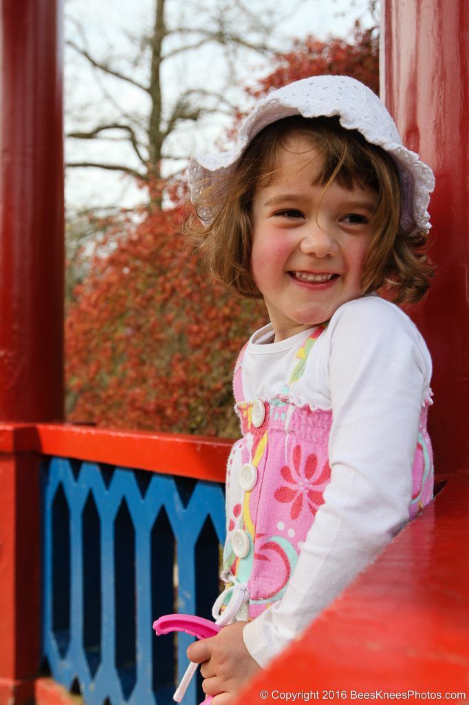 a smiling girl in a bandstand