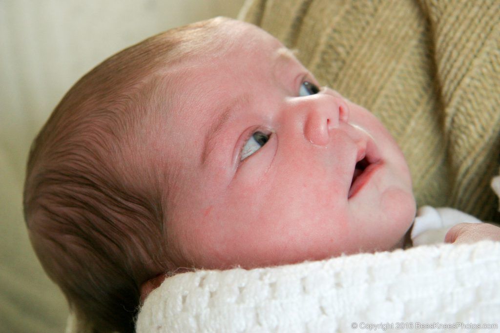 baby wrapped in a white blanket