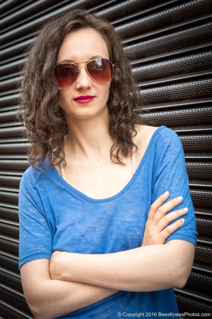 informal urban portrait of a woman in blue