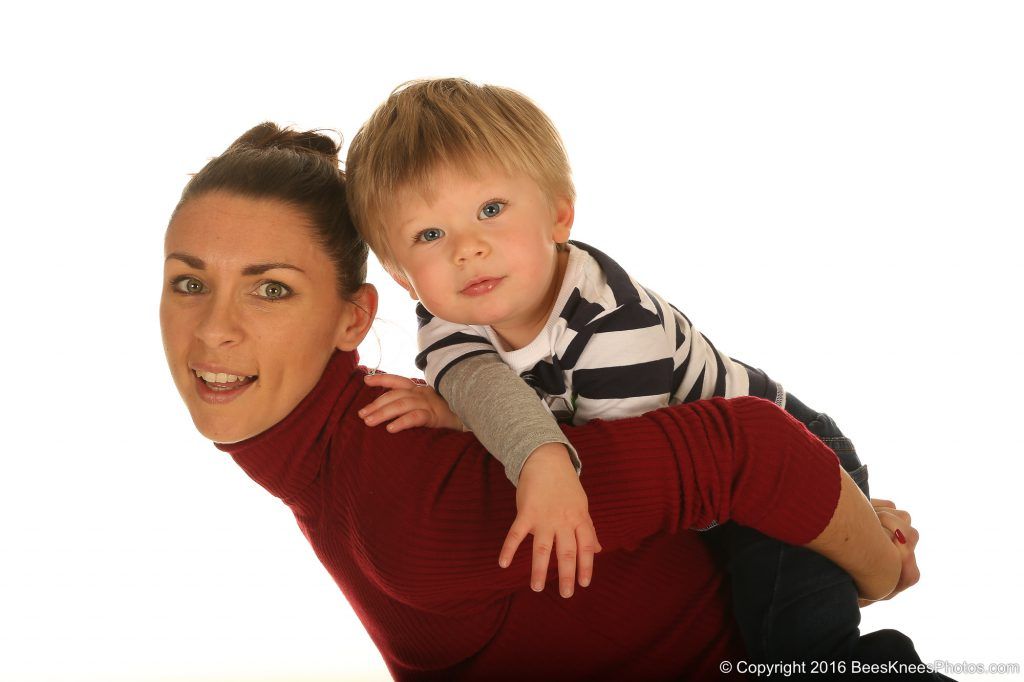 mum giving son a piggy back