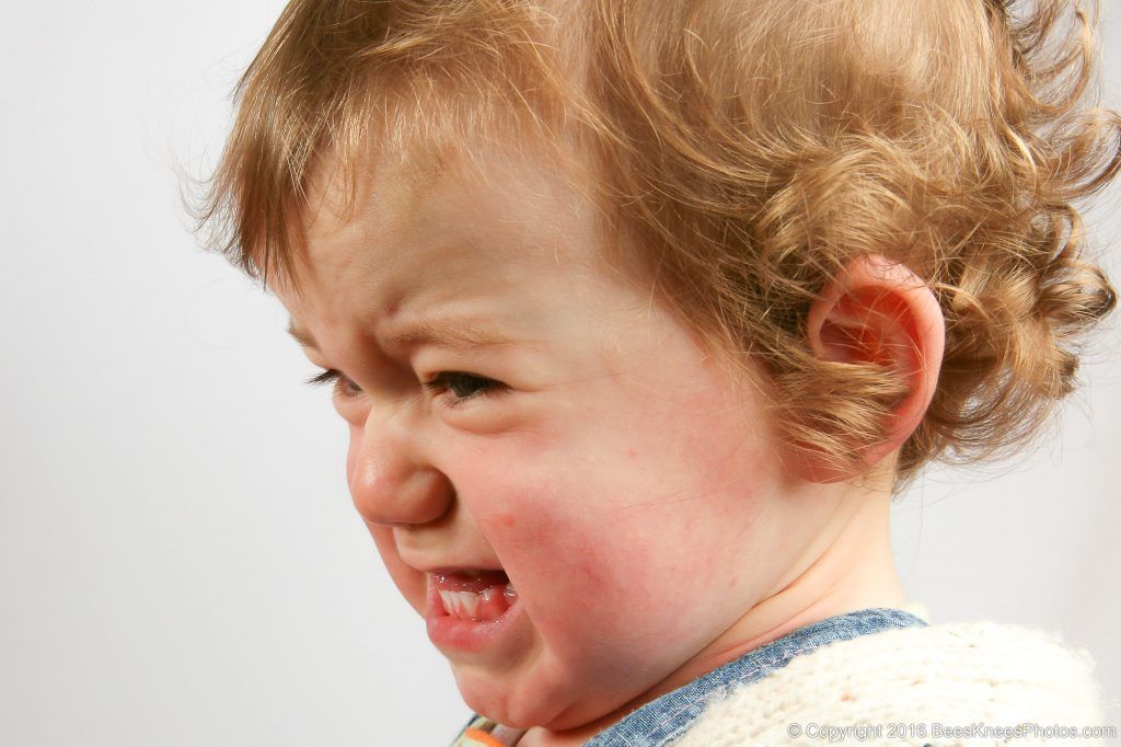 sad crying young girl during a studio photoshoot