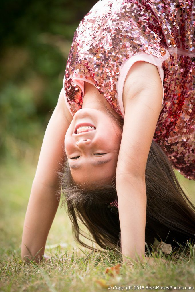 young girl doing a handstand